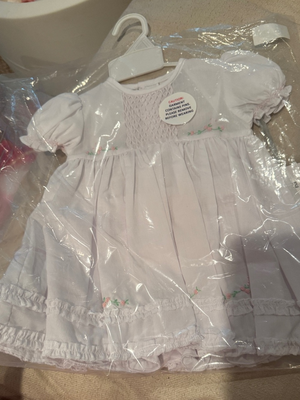 Classic White Smocked Baby Dress with Pink Floral Accents